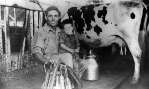 Miro Curti & son, Italo, with their first milking machine. 1924